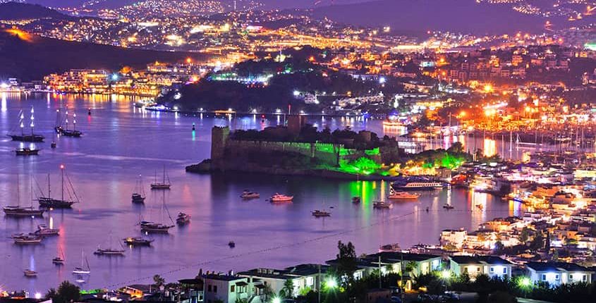 View of Bodrum harbor and Castle of St. Peter by night. Turkish Riviera